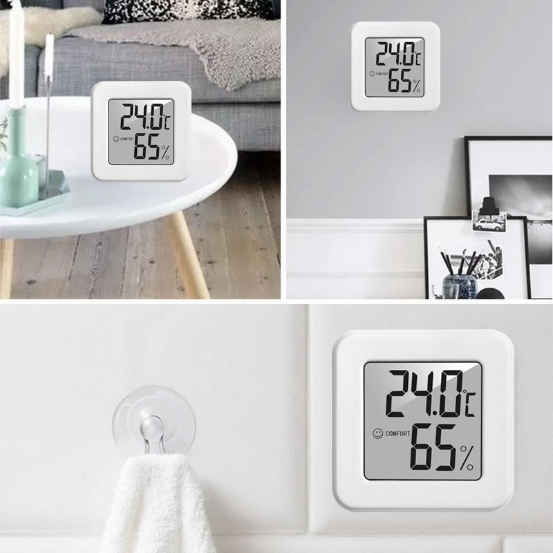 Mini Termohigrómetro electrónico  (temperatura y humedad relativa) pantalla de cara sonriente, color blanco.